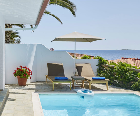 Eagles Palace Resort Chalkidiki Presidential Bungalow private swimming pool with sunbeds and umbrella